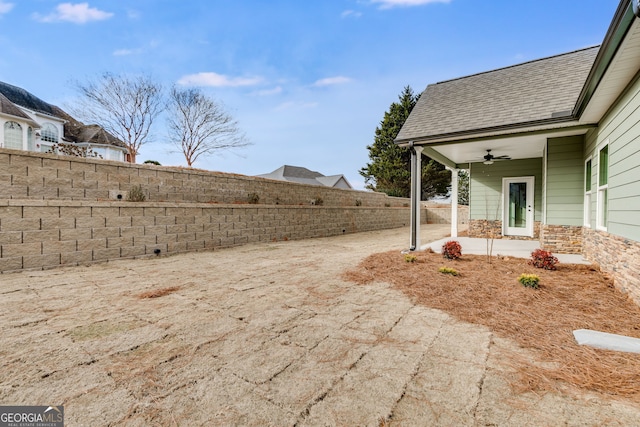 view of yard with a patio and ceiling fan