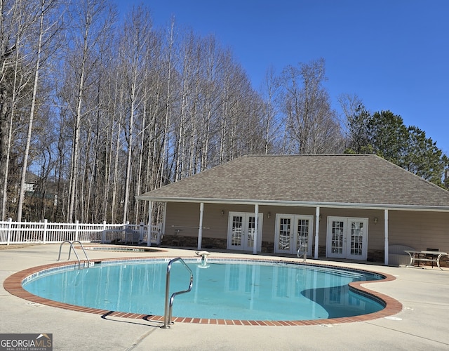 view of pool with a patio area and french doors