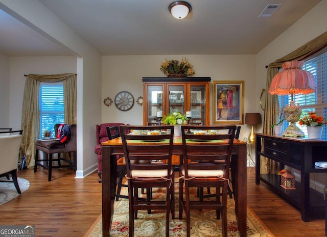 dining room with hardwood / wood-style flooring