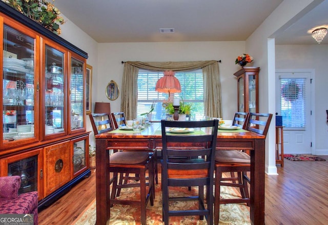 dining area with light hardwood / wood-style floors