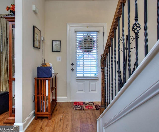 entryway featuring plenty of natural light and light hardwood / wood-style floors