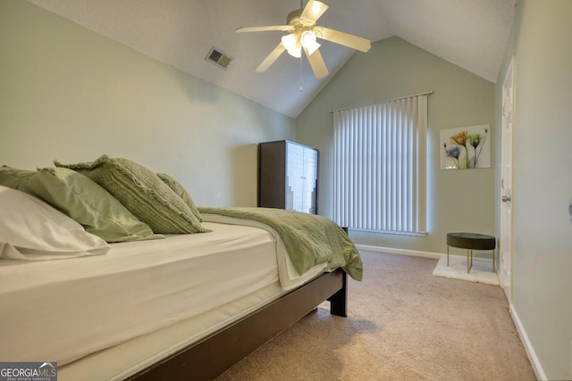 bedroom featuring lofted ceiling, light carpet, and ceiling fan