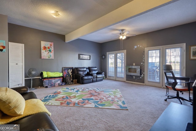 living room with french doors, a textured ceiling, light carpet, and beamed ceiling