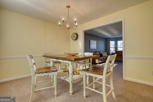 carpeted dining space featuring a textured ceiling and a notable chandelier