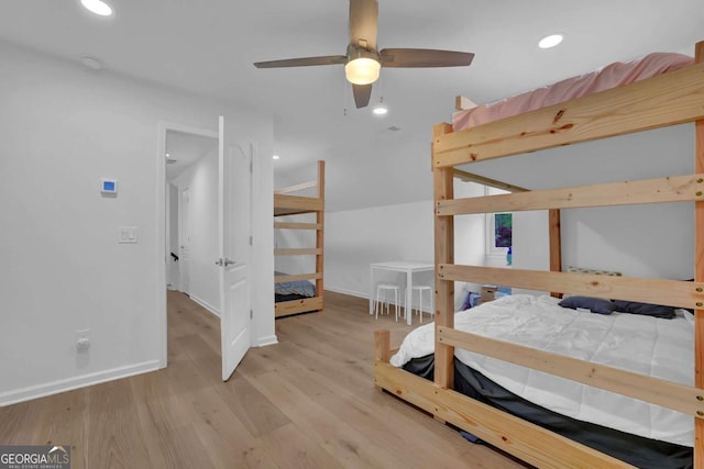 bedroom with ceiling fan and light hardwood / wood-style floors