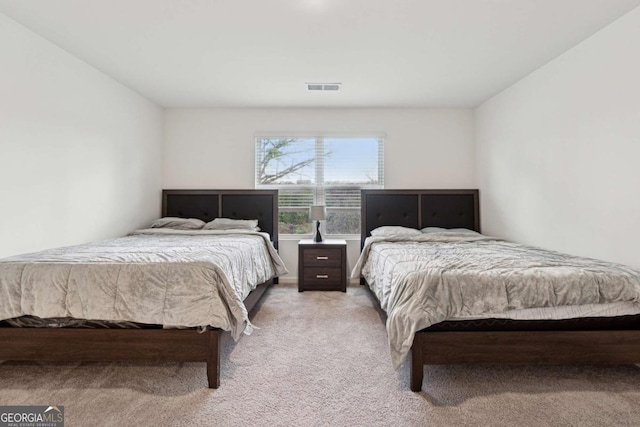 bedroom with light carpet