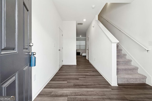 foyer entrance featuring dark hardwood / wood-style floors