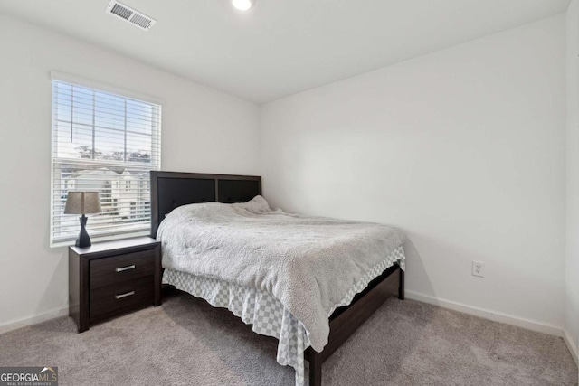 bedroom with light colored carpet