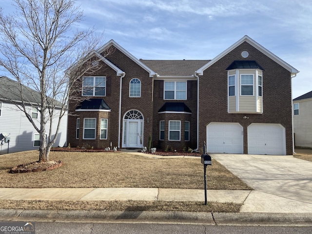 view of front of property featuring driveway, an attached garage, and brick siding