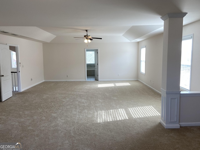 spare room featuring decorative columns, visible vents, baseboards, ceiling fan, and carpet floors