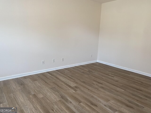 empty room featuring dark hardwood / wood-style floors