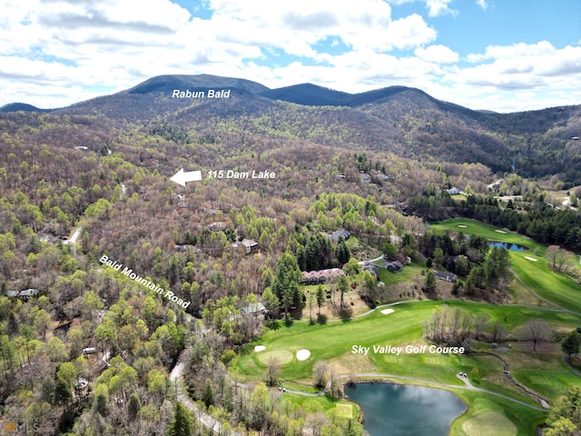 aerial view featuring a water and mountain view