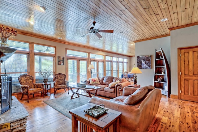 living room featuring light hardwood / wood-style flooring, ceiling fan, ornamental molding, and wood ceiling