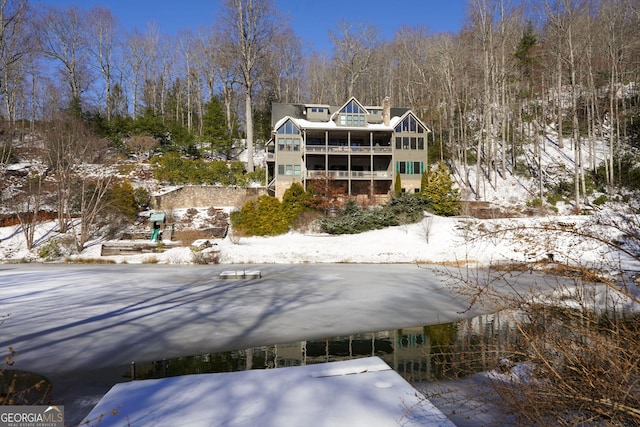 snow covered house with a balcony