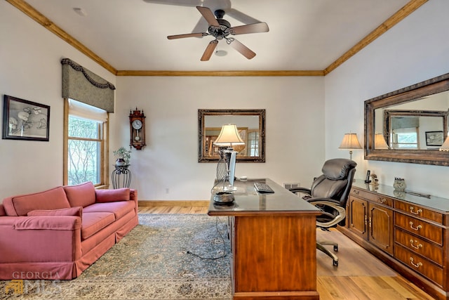 home office with ceiling fan, light wood-type flooring, and crown molding