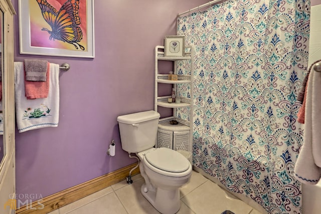 bathroom with walk in shower, tile patterned flooring, and toilet