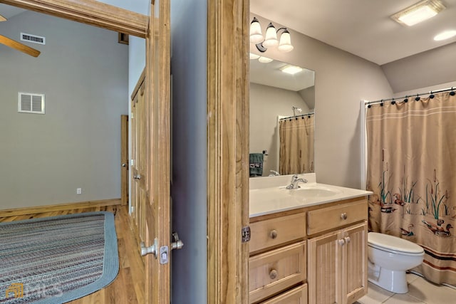 bathroom with a shower with curtain, vanity, and toilet