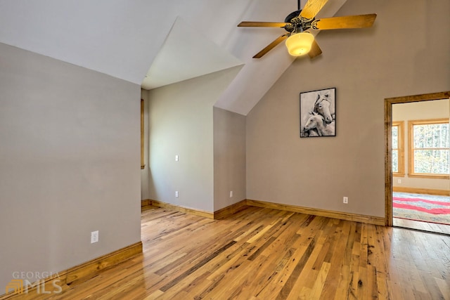 additional living space with light hardwood / wood-style flooring, ceiling fan, and lofted ceiling