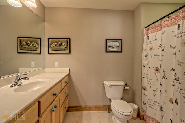 bathroom with tile patterned flooring, vanity, toilet, and curtained shower