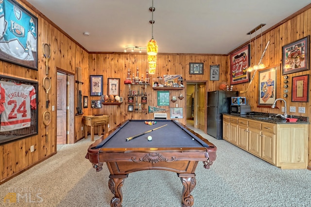 rec room with wood walls, light carpet, sink, crown molding, and billiards