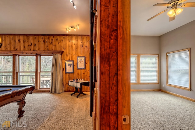 recreation room with a wealth of natural light, carpet floors, billiards, and wooden walls