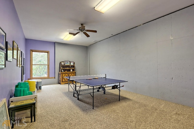 rec room with ceiling fan and carpet floors