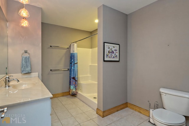 bathroom with toilet, vanity, and a shower with shower curtain