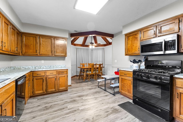 kitchen with ceiling fan, black appliances, and light hardwood / wood-style floors