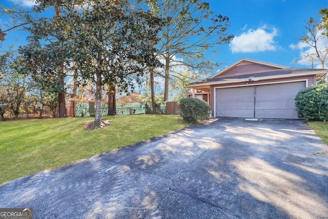 exterior space with a garage and a yard