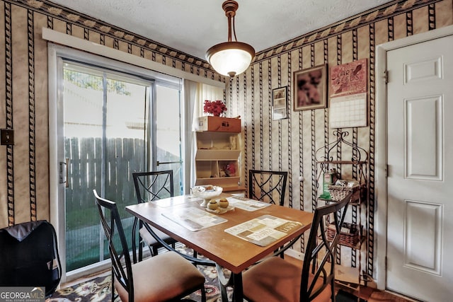 dining room with a textured ceiling