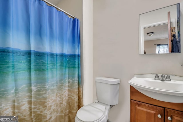 bathroom with vanity and toilet