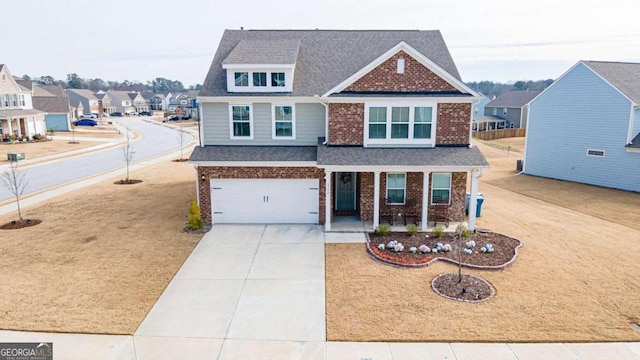 view of front of house with a garage and covered porch