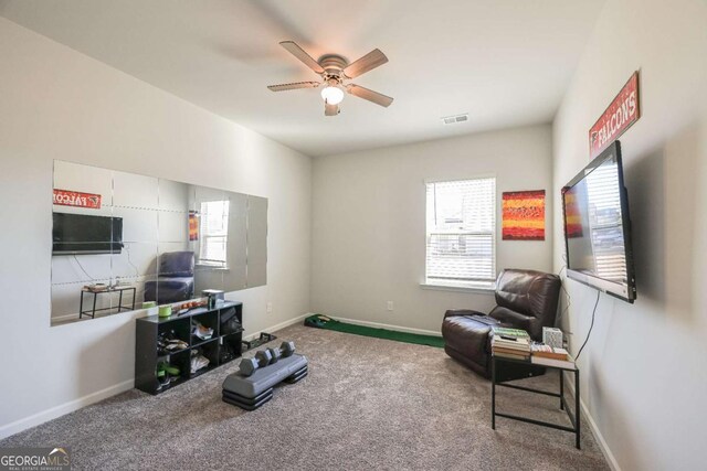 interior space featuring carpet and ceiling fan