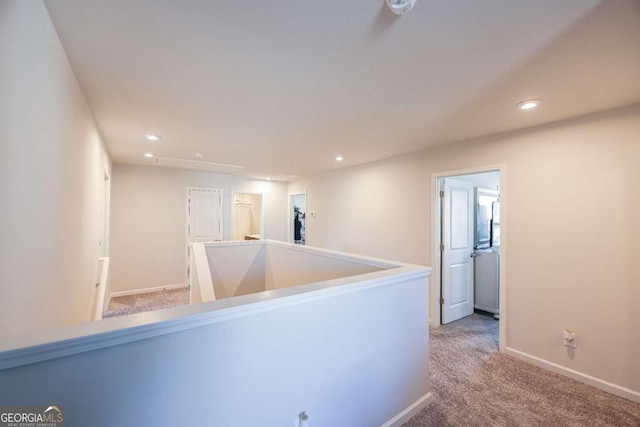 hallway with carpet flooring