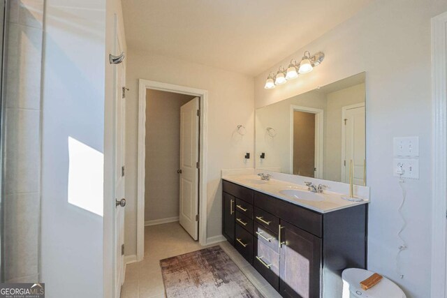 bathroom with vanity and tile patterned flooring