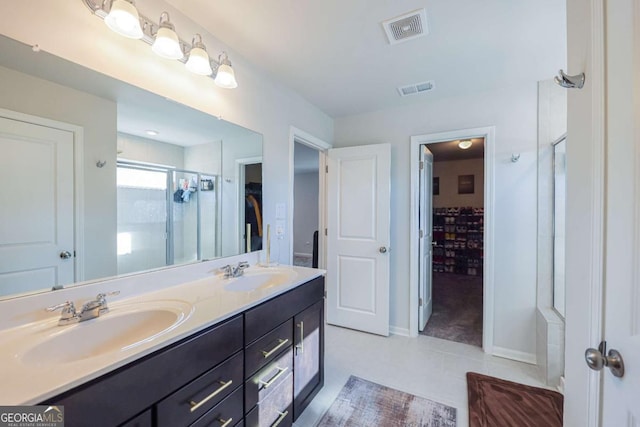 bathroom with vanity and a shower with door