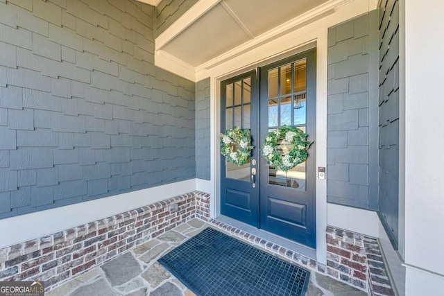 view of exterior entry featuring french doors