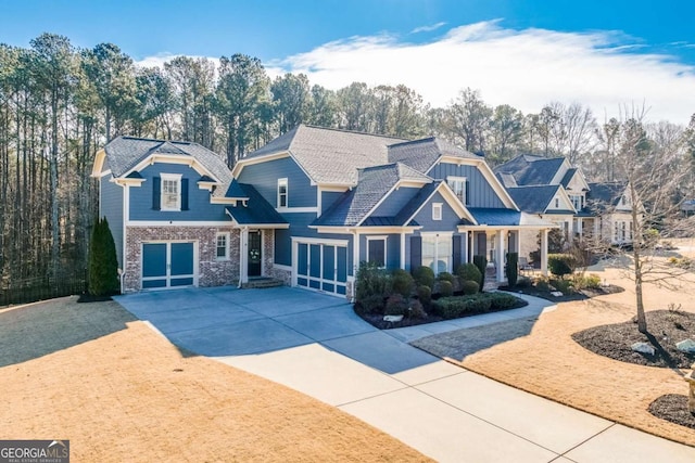 view of front of property with a garage, driveway, and board and batten siding