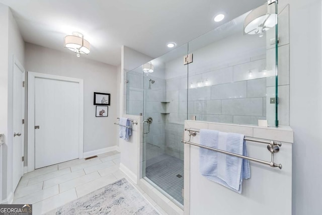 full bathroom featuring visible vents, baseboards, tile patterned flooring, a shower stall, and recessed lighting