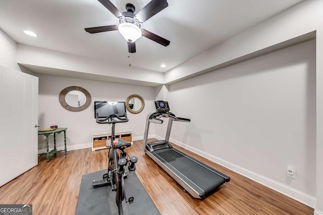 workout area featuring recessed lighting, ceiling fan, baseboards, and wood finished floors