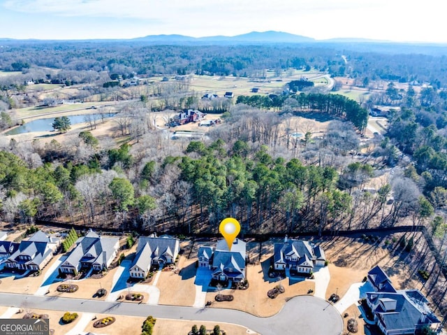 drone / aerial view with a residential view and a water and mountain view