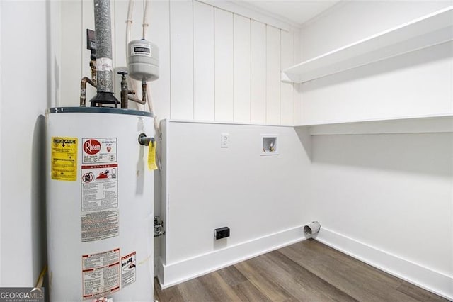 laundry area with hardwood / wood-style flooring, electric dryer hookup, hookup for a washing machine, and water heater