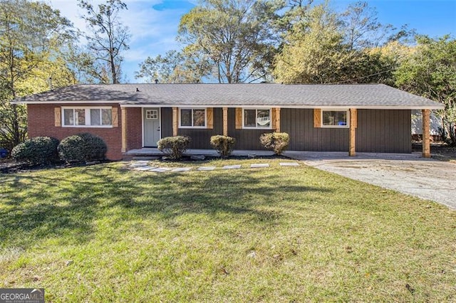 ranch-style house with a carport and a front lawn