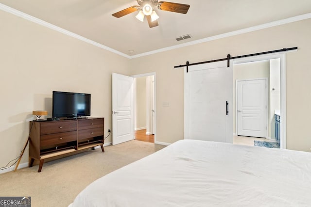 carpeted bedroom featuring a barn door, ceiling fan, and crown molding