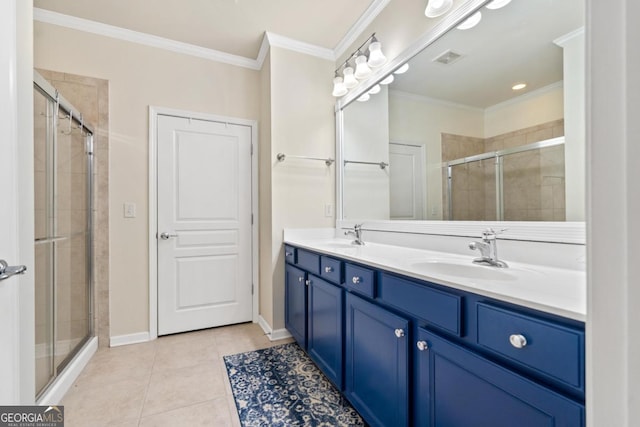 bathroom with tile patterned floors, vanity, an enclosed shower, and crown molding