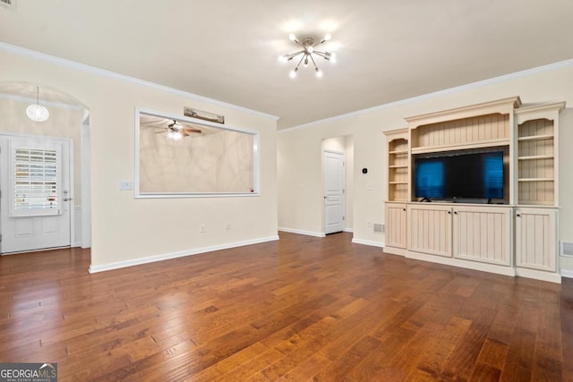 unfurnished living room featuring dark hardwood / wood-style flooring, crown molding, and an inviting chandelier