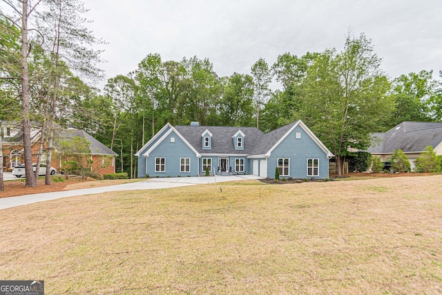 new england style home with a front yard