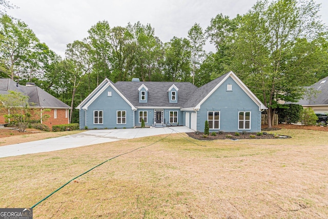 cape cod house with a front yard