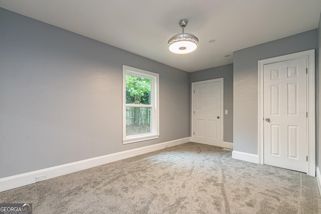 unfurnished bedroom featuring carpet flooring