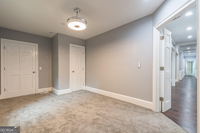 interior space with dark colored carpet